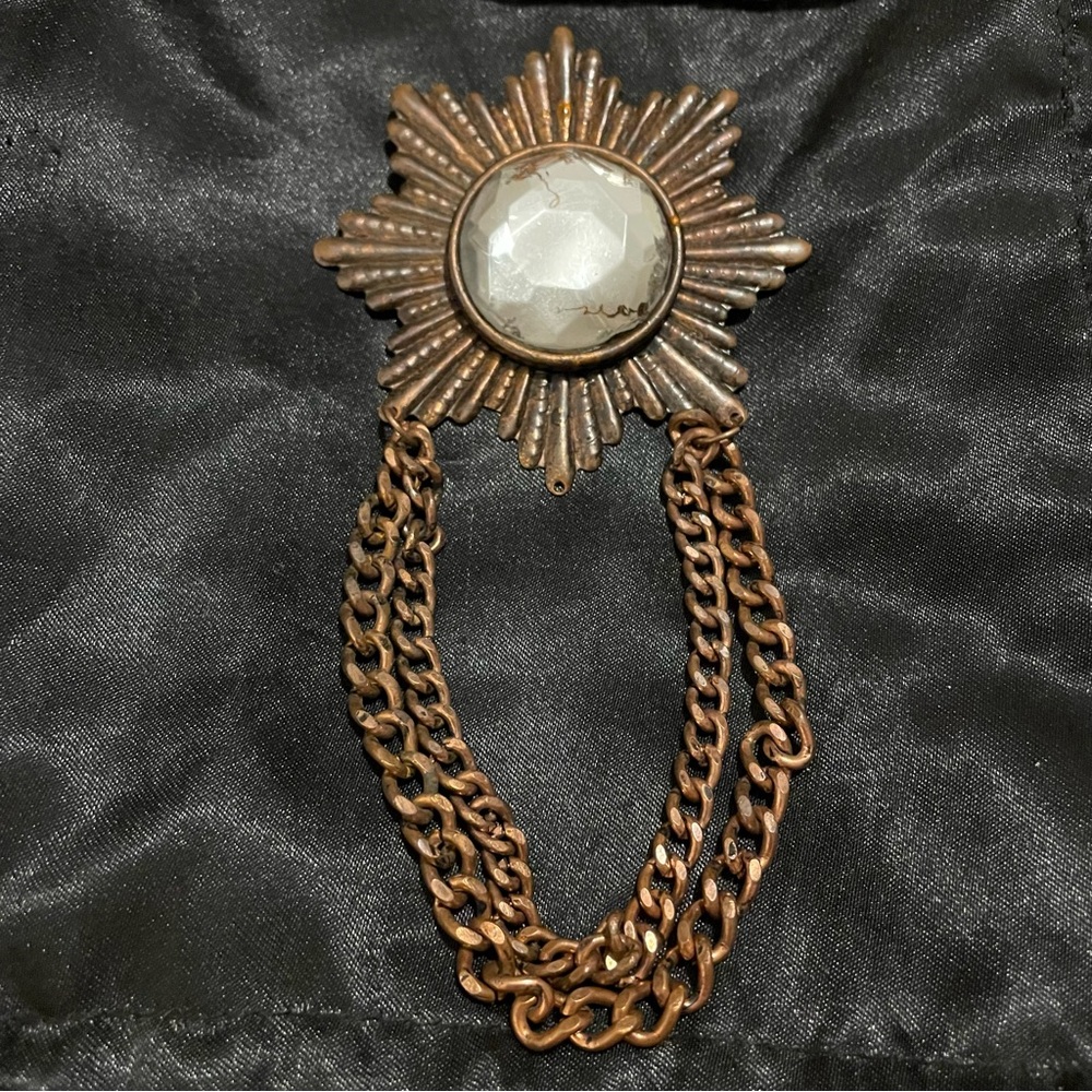 Antique-Style Bronze Starburst Brooch with Faceted Clear Stone